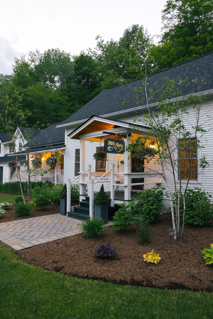 Exterior front view of Mile Away Stowe farmhouse rental in Vermont
